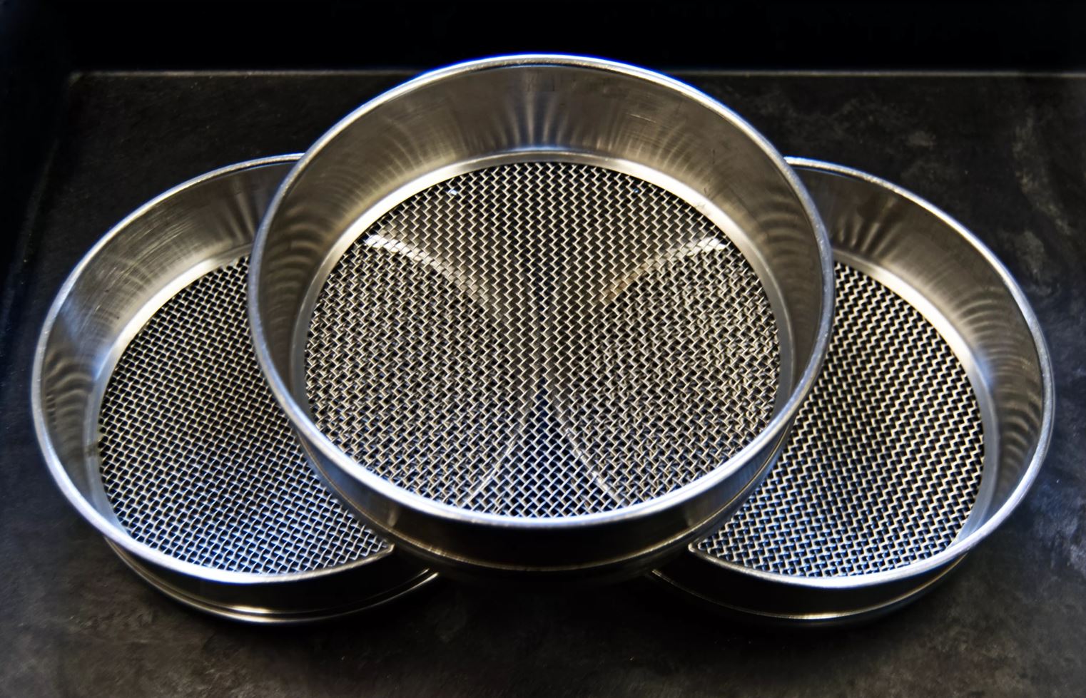 Laboratory sieves with different mesh sizes used to separate particle-size fractions.